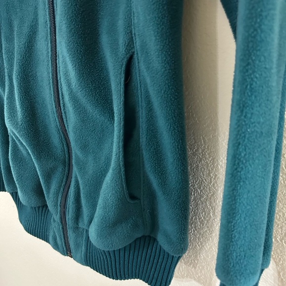 Columbia Women's Benton
Springs Full Zip Fleece Jacket in a teal color. - Picture 3 of 10